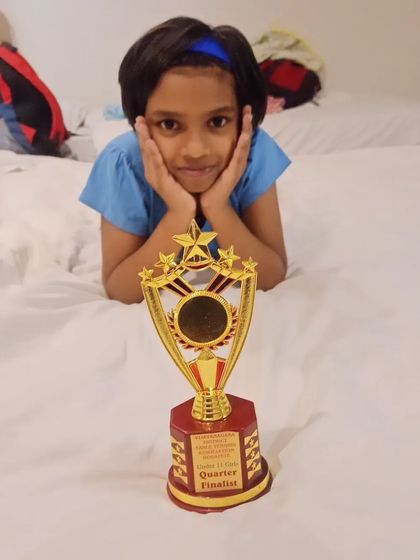 The sweet taste of success. Ghanavi with her Quarter Finalist trophy, a reward for her perseverance and skill on the national stage.