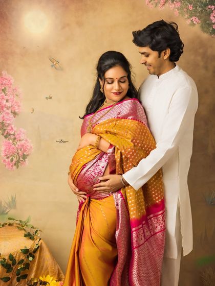 An intimate embrace between a couple during their traditional maternity photoshoot. This pose beautifully highlights their connection and the protective love for their coming baby.