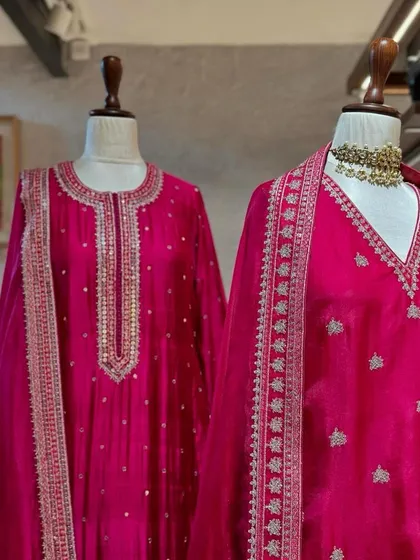 A close-up of the fine silver embroidery on these pink silk kurtas, showcasing the delicate craftsmanship that goes into each piece.