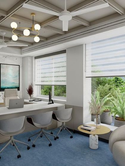 This office design concept includes a long, collaborative workspace, ample natural light, and a coffered ceiling, creating a sophisticated and functional environment.