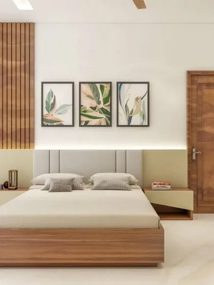 A bedroom design that combines light wood tones with a clean white palette. The vertical wood slats behind the bed add texture and warmth.