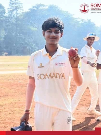 Star bowler Swayam Wamne holds up the cricket ball, celebrating his brilliant 7-wicket haul that led S K Somaiya Vinay Mandir Junior College to a 9-wicket victory.