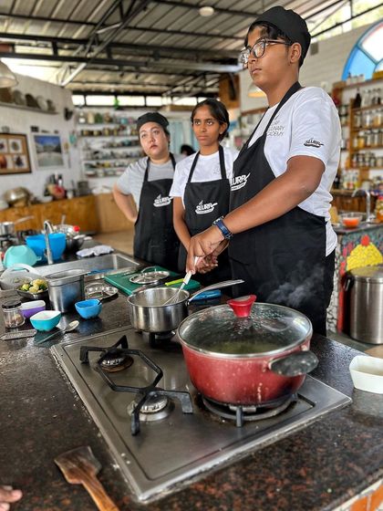 Students in our pre-professional program observing a demonstration before starting their own practical session.