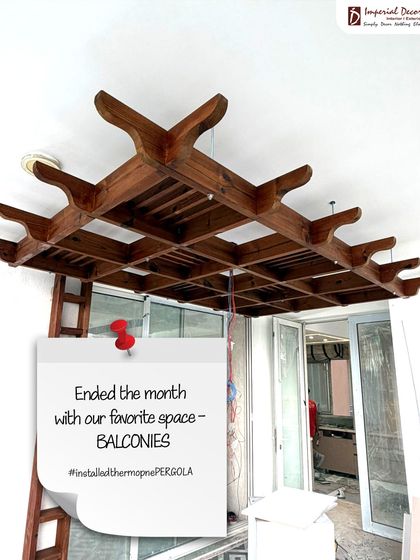 This is a look at a project in progress. We installed this custom Thermopine wood pergola on a client's balcony. It shows how we can add architectural detail and create a defined, stylish outdoor area, even before the final finishing touches are in place.