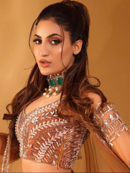 A close-up of the model, showcasing her beautiful makeup and our statement choker.