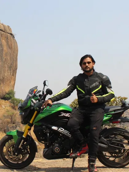 Another shot of the rider and his green Dominar, ready for the next adventure.