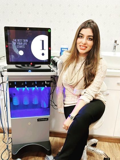 Dr. Niranjana Raj with our original Hydrafacial MD machine. She ensures that our clinic invests in only authentic, gold standard technology for the best patient outcomes.