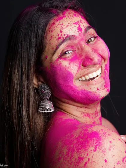 A beautiful, genuine smile captured during our Holi shoot. This photo is all about the pure, uninhibited joy that comes with celebrating with colors.