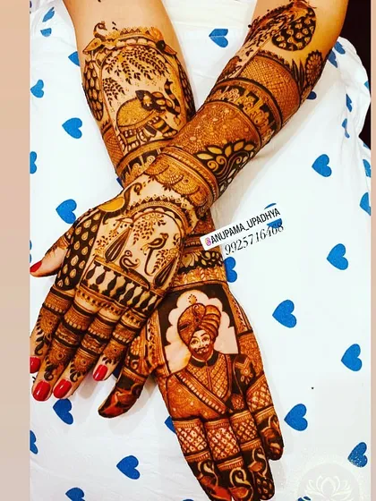 A bridal creation featuring a groom's portrait on one hand and traditional motifs on the other, a unique and personalised combination.