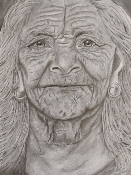 The finished pencil portrait, showcasing the intricate details of the wrinkles and hair. Capturing a life lived through drawing is a powerful skill.