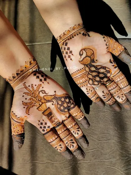 A minimalist yet charming peacock design. The simple shapes and dot work create a modern and stylish look, perfect for someone who wants a touch of tradition without a heavy pattern.
