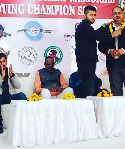 Our founder honoring a guest at a shooting championship. We are committed to fostering a culture of respect and sportsmanship within the shooting community.