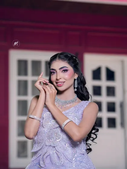 A happy and confident pose in the lavender gown.
