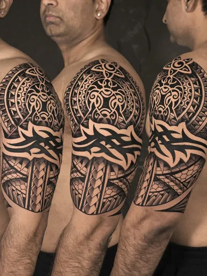 Bold, powerful, and timeless. This Polynesian-style sleeve was a two-day project, meticulously designed to honor traditional patterns while creating a custom piece that flows with the client's physique. It's art built to last.