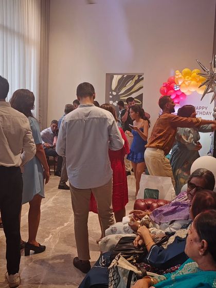 Guests mingling and enjoying the food at a birthday party I catered. It brings me so much joy to see people having a great time while I take care of the food.