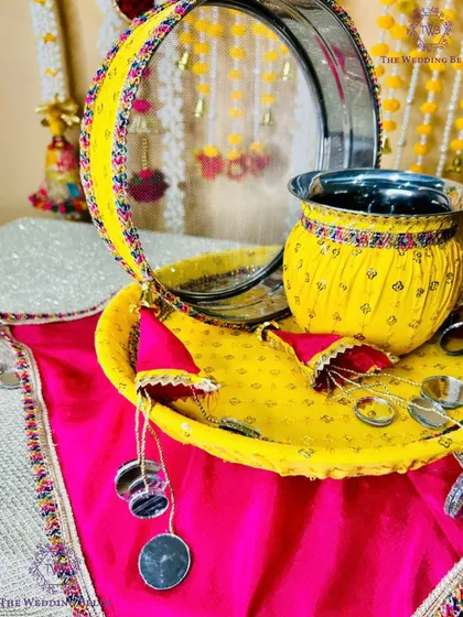 This yellow and pink thali set from our 'CHAAND' collection is perfect for a bright and cheerful Karwachauth celebration.
