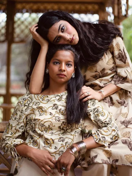 I love creating a narrative between models. This image shows how I direct talent to create a genuine connection, making the shot feel like a real moment. It showcases two variations of a Bagru print top, demonstrating how the same design can be styled and worn, which is great for lookbook photography.