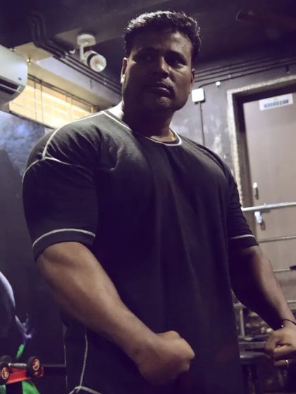 Grinding to build bigger biceps. Even as a powerlifter, we work on building impressive arms to complement our strength.
