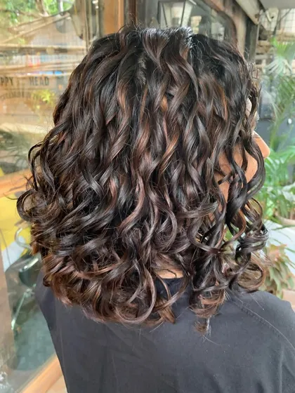 Another shot of the curly bridal bob, a perfect example of how to color curls without compromising their health.