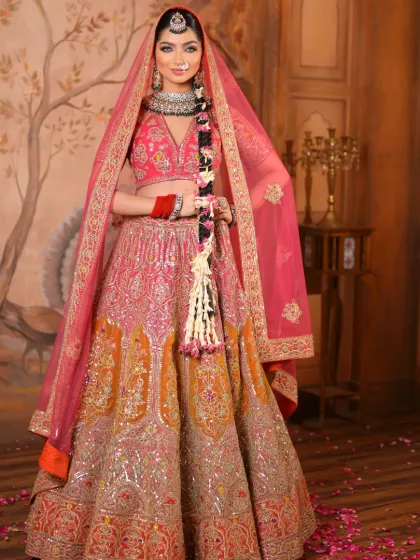 A full-length shot that captures the grandeur of her lehenga and the elegance of her pose. The makeup is radiant and ensures she stands out.
