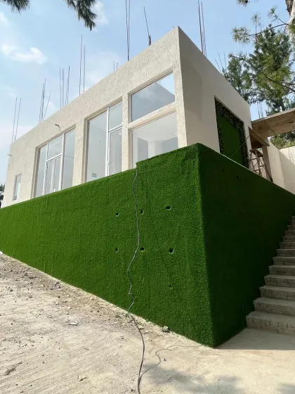Another angle of the Theog project, showing the clean lines of the 25mm Vietnam Grass I used for the plain grass wall. It's a durable solution for outdoor exteriors.