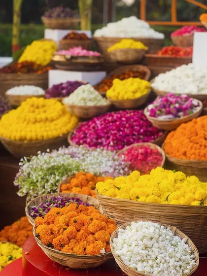 A flower shower station is a must for Indian weddings. We love creating beautiful displays with baskets of fresh, colorful petals for guests to toss in celebration.