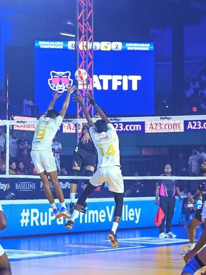An intense moment at the net during a Prime Volleyball League match. This action shot captures the thrilling gameplay that our production aims to highlight.