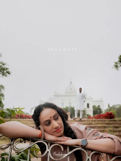A beautiful portrait of the bride-to-be, with her soulmate softly focused in the background, set against a heritage building.