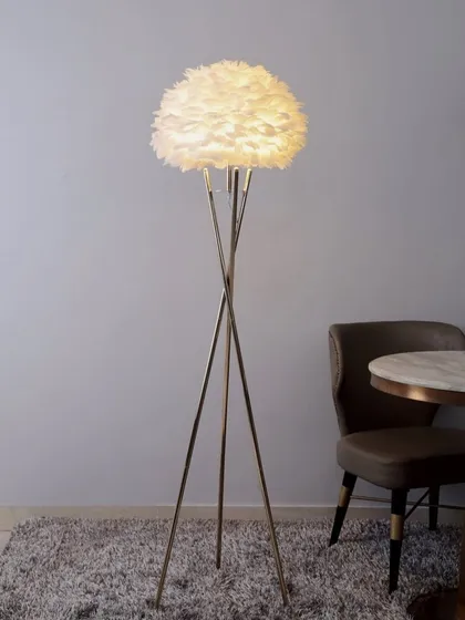 For a touch of softness and romance, we designed this feather floor lamp. The delicate, cloud-like shade diffuses light beautifully, creating a warm and inviting glow that adds a layer of texture and charm to any bedroom or living area.
