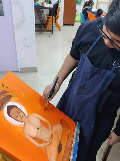 A series documenting a student's creation of a Jain spiritual painting, showing the careful application of color and detail.