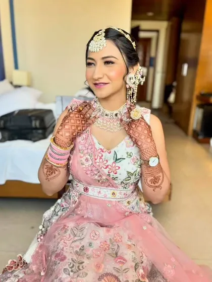 A happy and confident portrait, showing the complete look with hair, makeup, and jewelry.