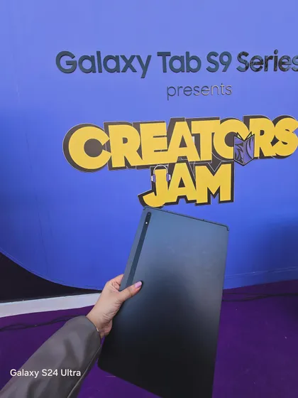 A close-up of the sleek Samsung Galaxy Tab S9. This shot focuses on the product's design, highlighting its premium feel for a tech-savvy audience.