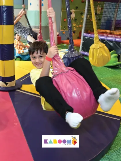 Another happy adventurer enjoying our colorful swings. It's a favorite for many of our visitors.