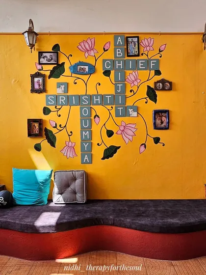 We can get really creative with custom designs. This unique wall combines a family name crossword puzzle with delicate Pichwai-style lotus art, creating a deeply personal and functional piece that holds both memories and beauty.
