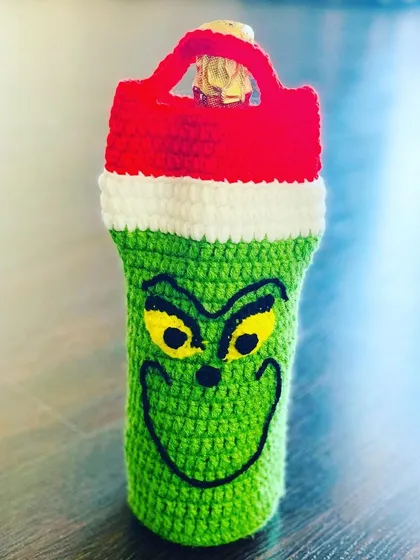For those who love a bit of mischief during the holidays, I created this Grinch wine bottle cover. It's a fun and unique design that's perfect for gifting.