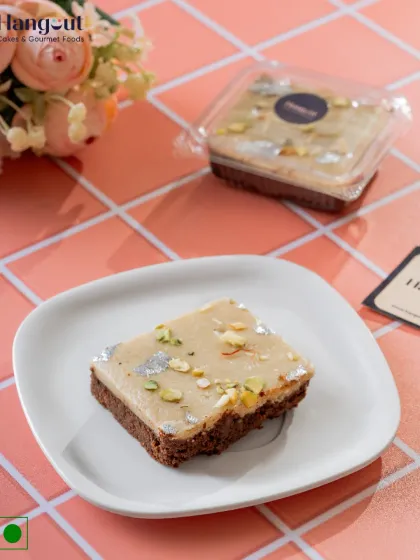 Where tradition meets indulgence. Our Kaju Katli Brownie is the perfect fusion, topping a rich, fudgy brownie with a layer of royal kaju katli, nuts, and silver varq.