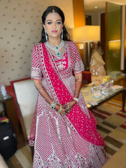 A full-length view of this gorgeous wedding guest look. The makeup is designed to last all day while looking fresh, radiant, and perfectly matched to her outfit.