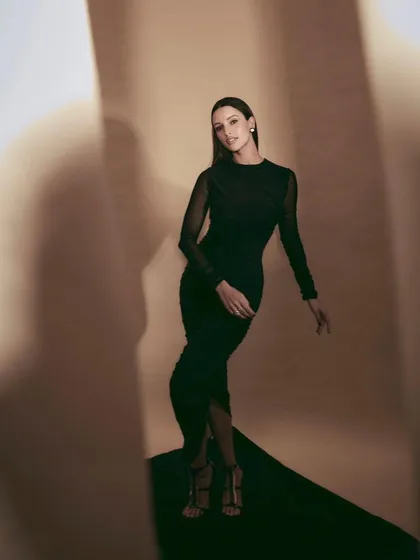 An all-black look is always a classic. I styled Tripti Dimri in this elegant ruched black dress with sheer sleeves, creating a sophisticated and versatile look suitable for many occasions.