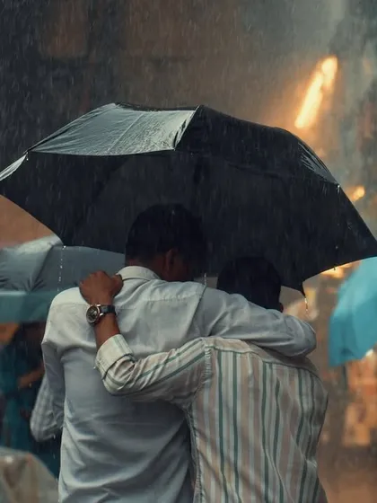 This is what I look for: real, unposed connections. Two friends sharing an umbrella in the pouring rain is a simple, powerful story of camaraderie. It’s these candid moments that make the most honest and memorable photographs.