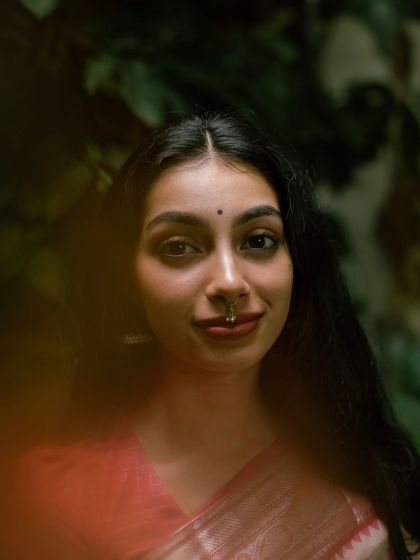 A close-up portrait with a soft, out-of-focus foreground. This shows a more artistic and intimate style of photography that I enjoy experimenting with.