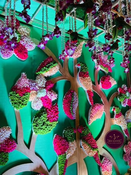 A unique 'tree of life' backdrop made entirely of flowers. This is an example of the creative and custom designs we teach, pushing the boundaries of floral art for themed events.