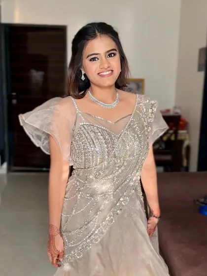 Soft glam with a moonlit glow. This subtle look with shimmer lids and an elegant silver outfit is perfect for a reception or cocktail party.
