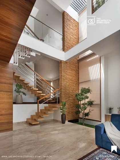 The living area of the Cube House demonstrates how we use vertical space. A double-height ceiling and a large skylight make this compact home feel expansive, while the stone-clad wall adds texture and warmth, connecting the different levels of the house.