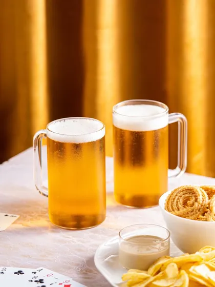 We created a game night atmosphere for these Borosil beer mugs, complete with cards and snacks, to showcase them in a social, entertaining context.