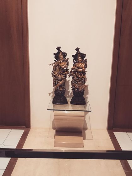 A closer view of the displayed statues, showing their intricate craftsmanship.