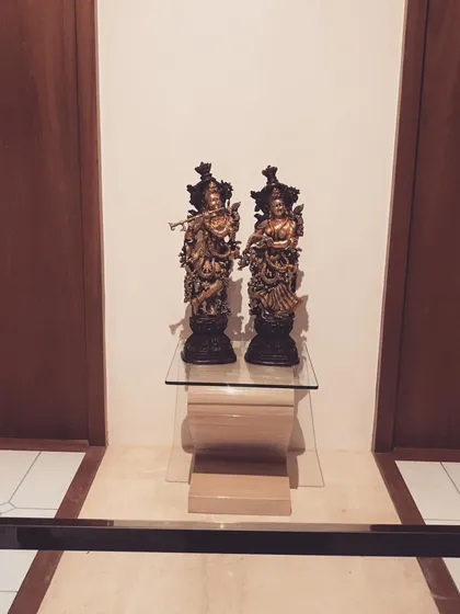 A closer view of the displayed statues, showing their intricate craftsmanship.