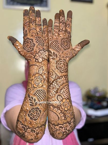 A playful pose showing off the full-coverage floral design. It’s a perfect choice for a bride who loves flowers.