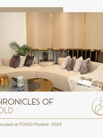 A detail from our FOAID showcase, highlighting a custom curved sofa with plush velvet cushions, set against a backdrop of gold-trimmed panels.
