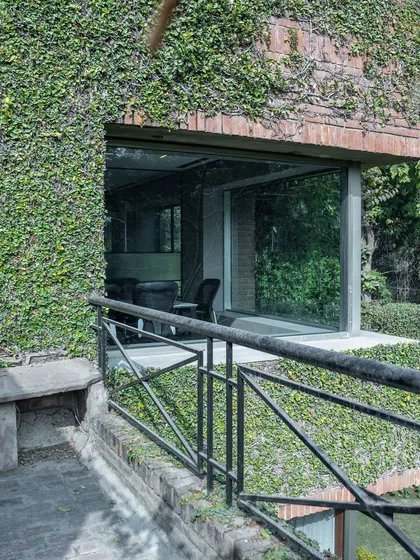 This project for a US-based international firm showcases my passion for biophilic design. The building's facade is covered in a living green wall, which not only creates a stunning visual but also improves air quality and connects the workspace with nature.