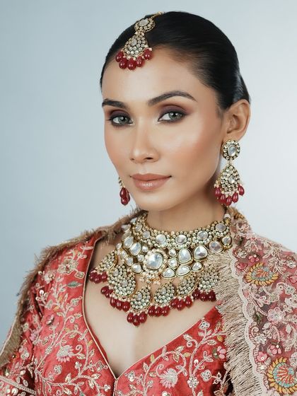 A direct portrait showcasing the flawless complexion and striking eye makeup. My students practice on diverse skin tones to become versatile and confident artists.